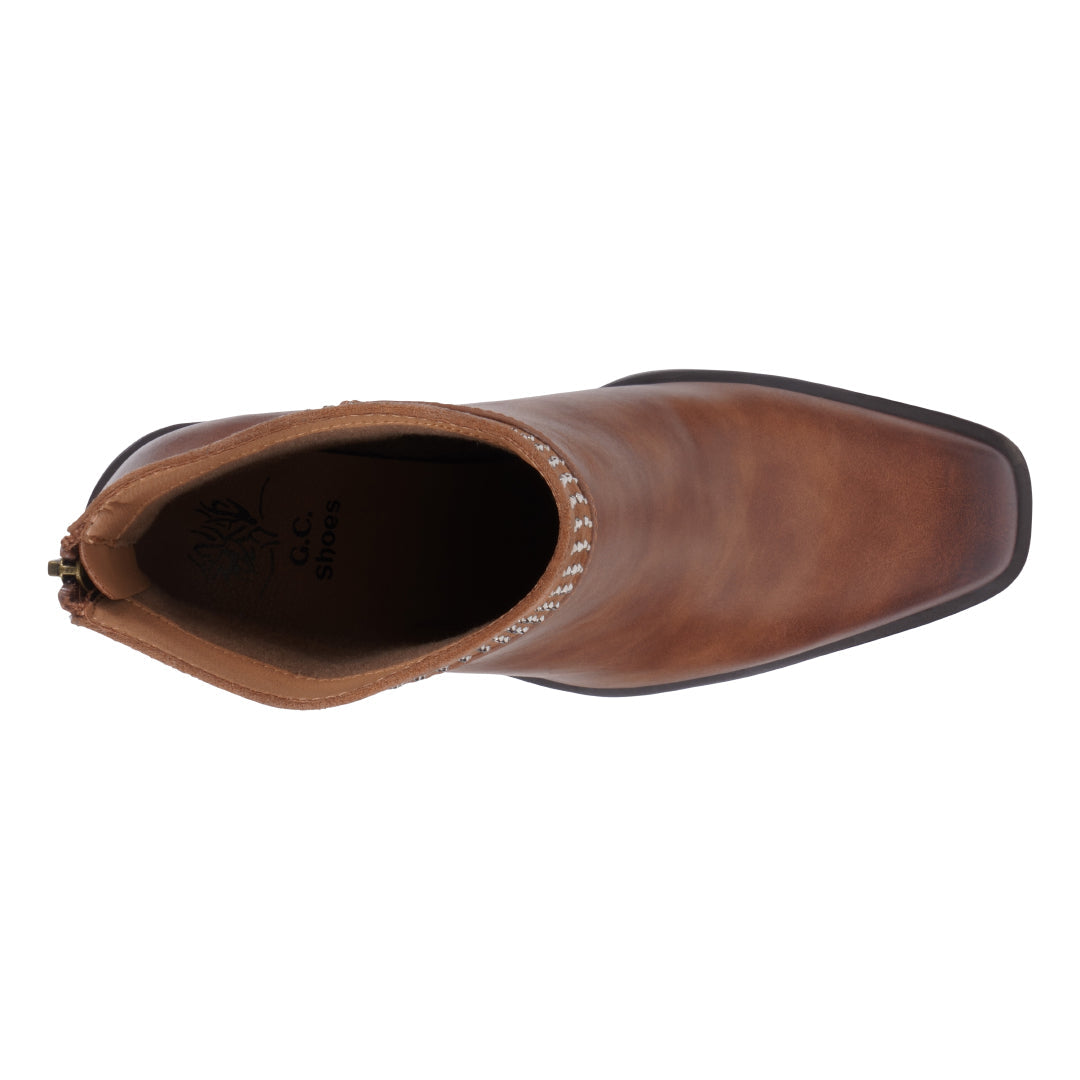 Brown leather boot on a white background